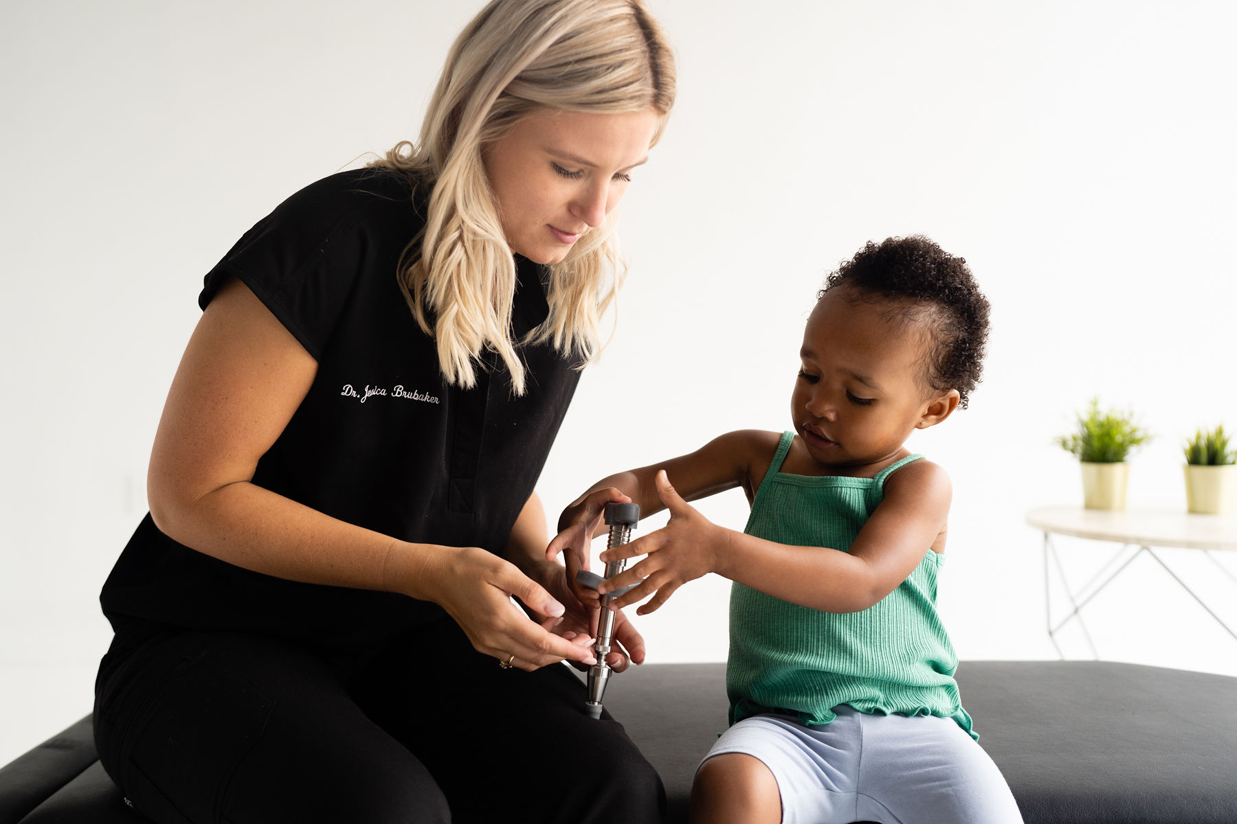 Dr. Alayna Pagnani Holding a Baby - Chiropractic Doctor in Houston Texas